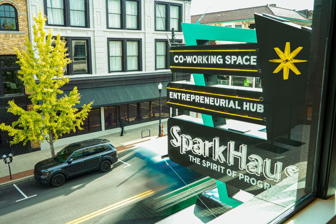 SparkHaus sign over Madison Avenue in Covington: co-working space, entrepreneurial hub